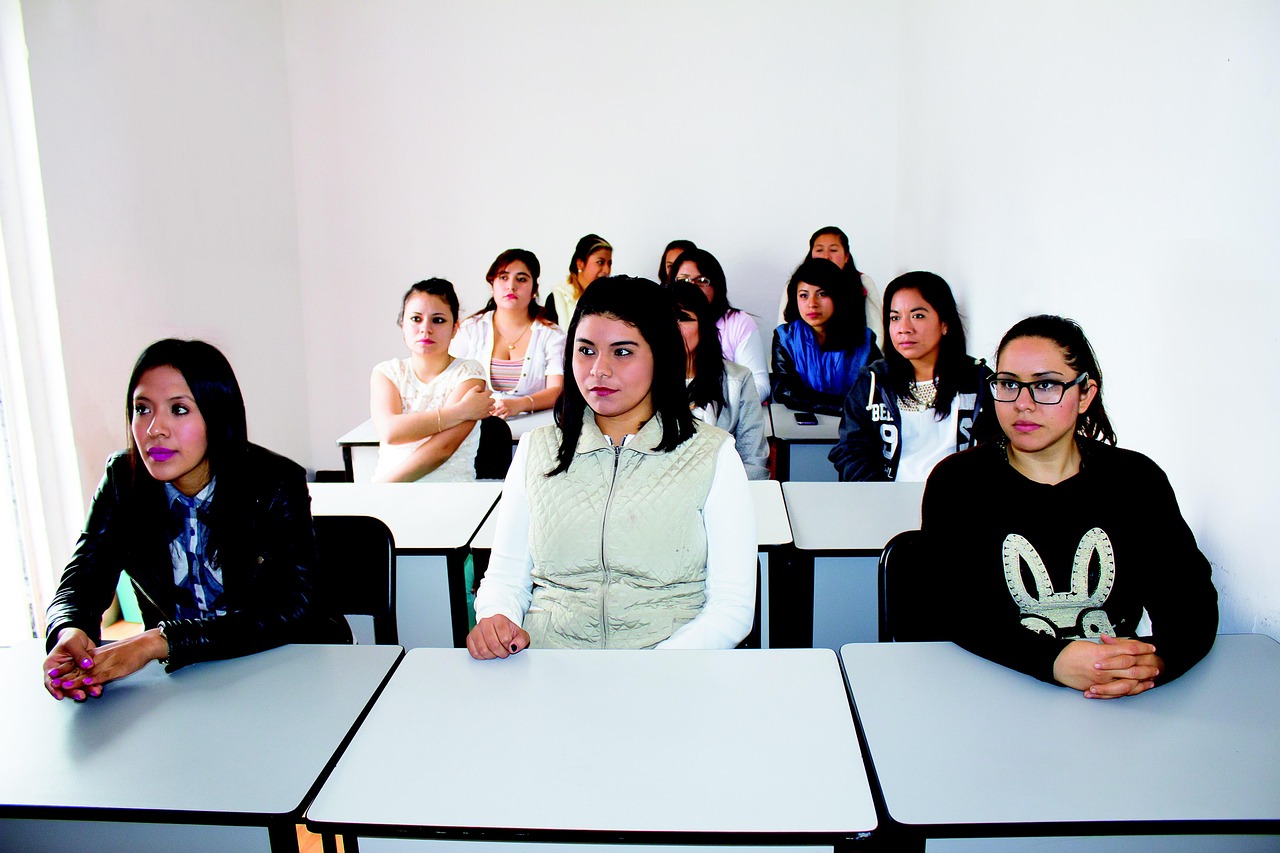 students who are sitting in a classroom